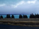 the blue waters of lake tekapo, mt cook hidden in the mist,