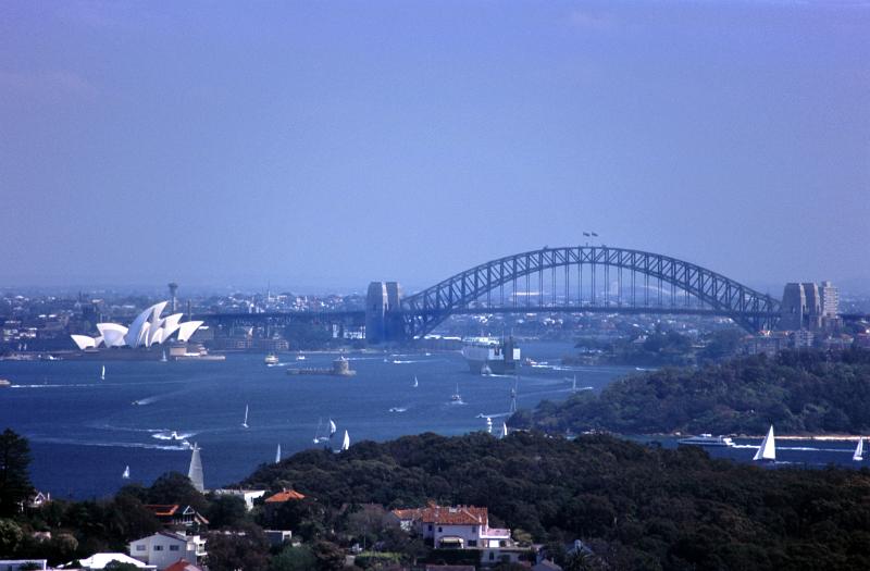View of Sydney Harbour with the Opera House and Sydney Harbour Bridge on a hot blue sky summer day