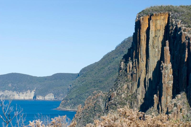 rugged dolertite cliffs framing an impressive seascape on the tasman peninsula