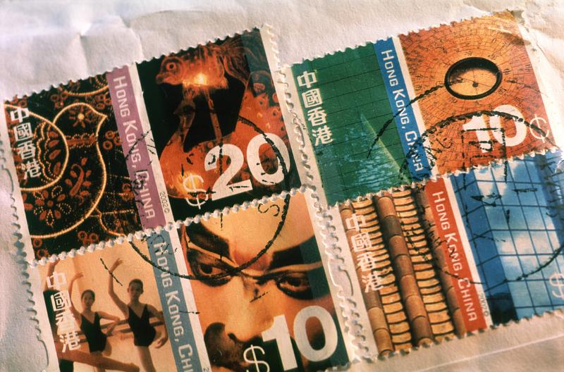 Assorted cancelled Japanese stamps on a packet or letter, close up view