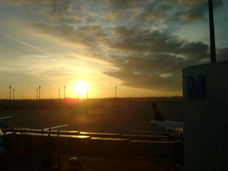 Dramatic Sunrise or Sunset over Airport Tarmac