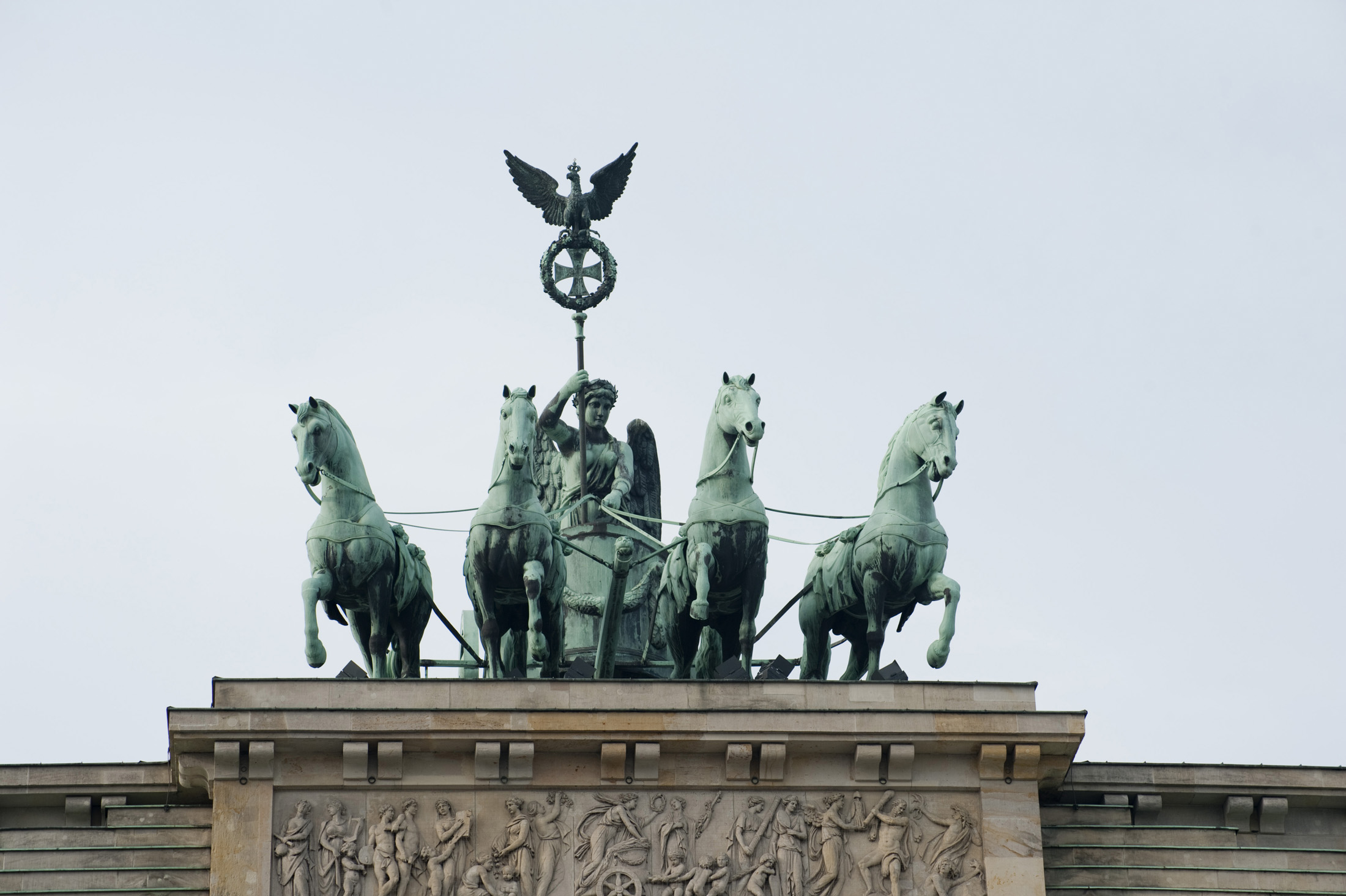 an image of Quadriga - roman chariot with four hourses on top of the brandenburg gate, berlin