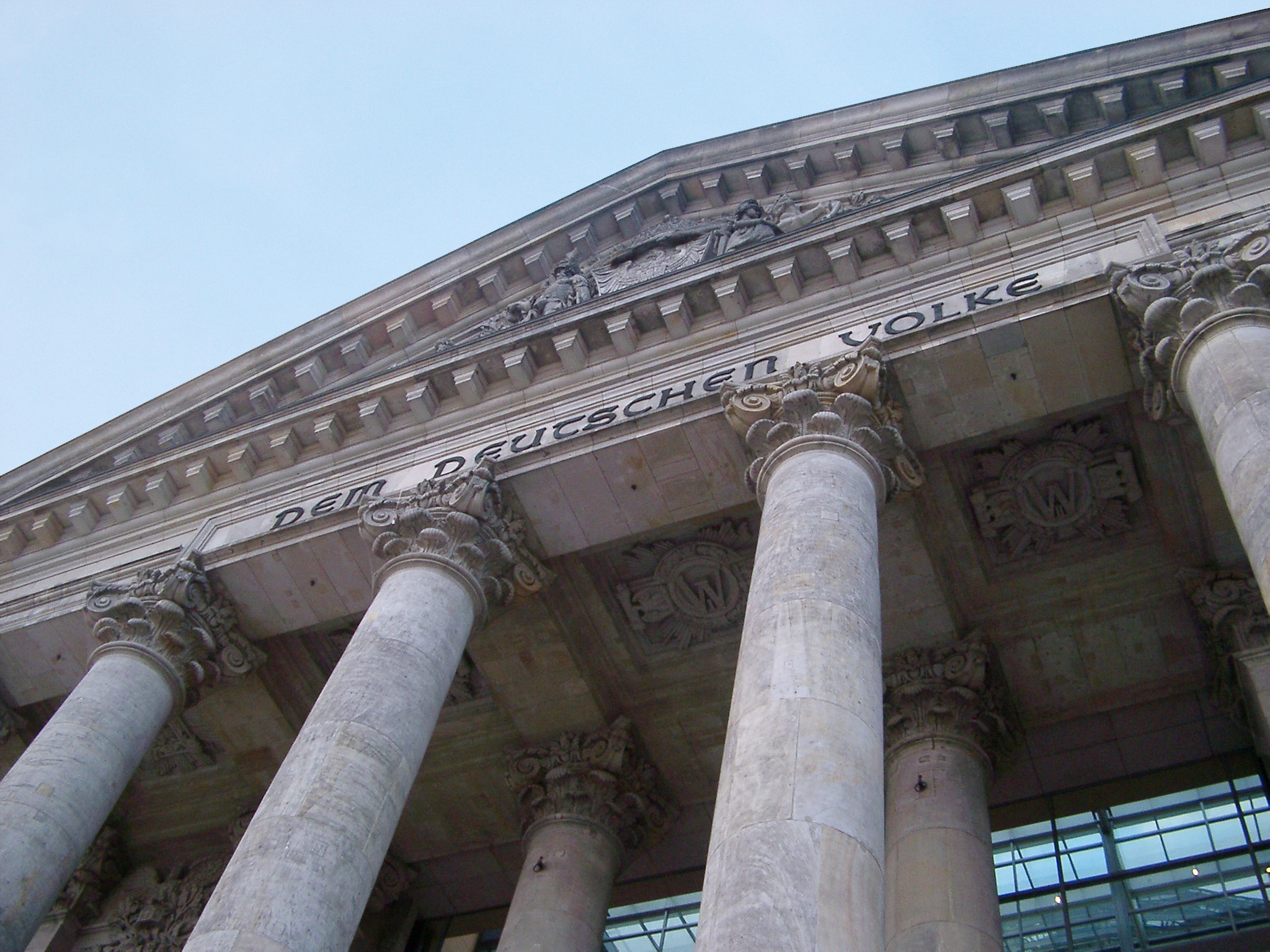 an image of Front facade of the Reichstag Building in Berlin, Germany, showing the front portico and colonnade and inscription on the frieze