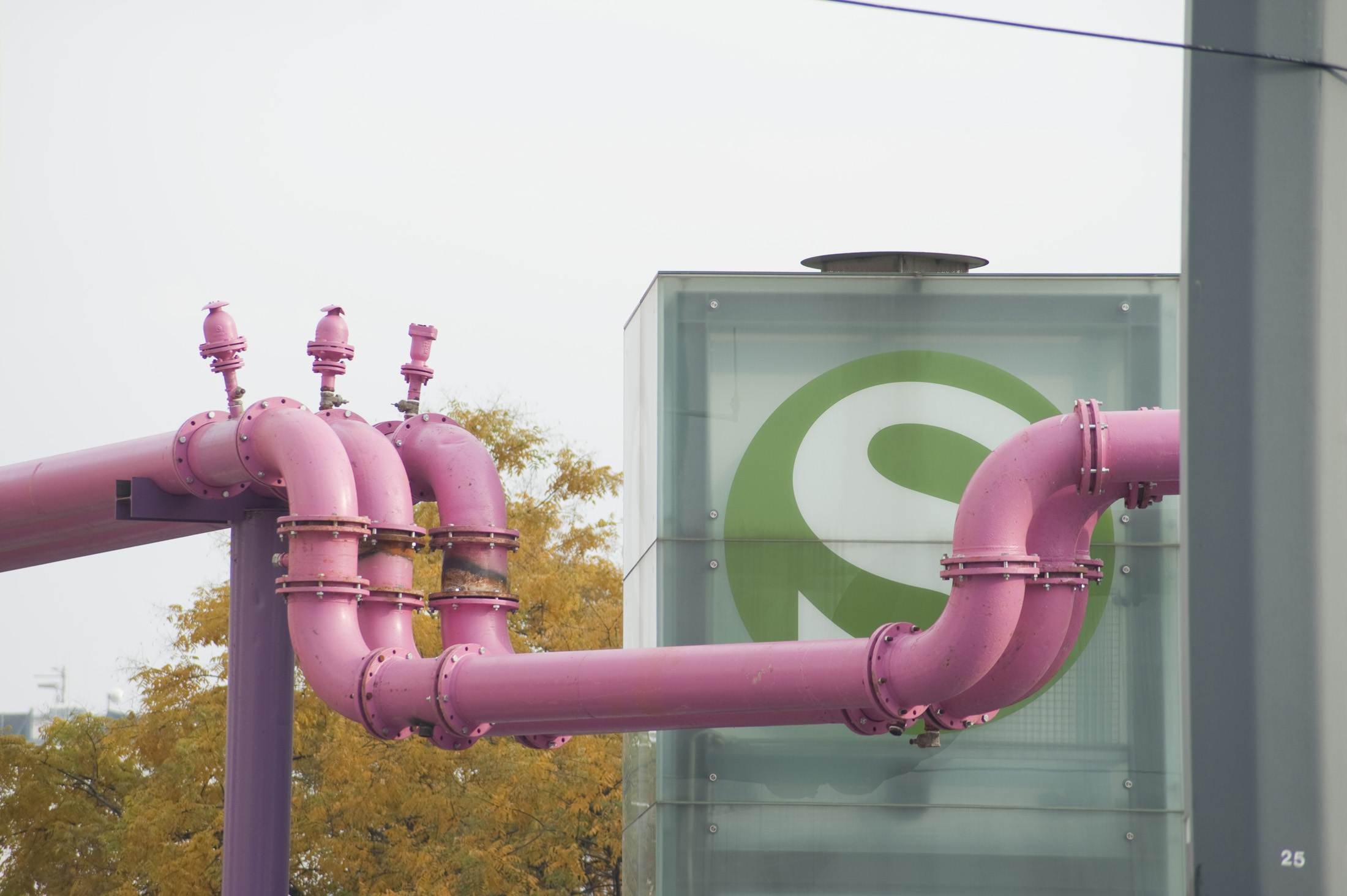 an image of pink water pipes and an s-bahn sign, berlin, germany