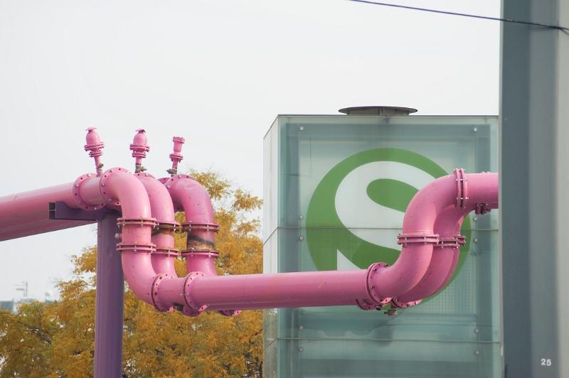 pink water pipes and an s-bahn sign, berlin, germany
