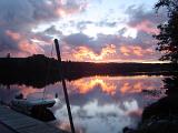 Boat at Dock on Lake at Sunset in Algonquin Park, Ontario, Canada