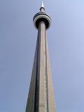Looking Up at CN Tower Against Blue Sky in Toronto, Canada