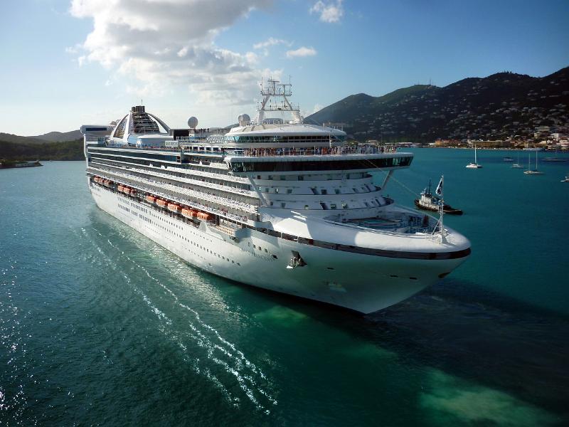 a large cruise liner sailing away from st thomas, US virgin islands