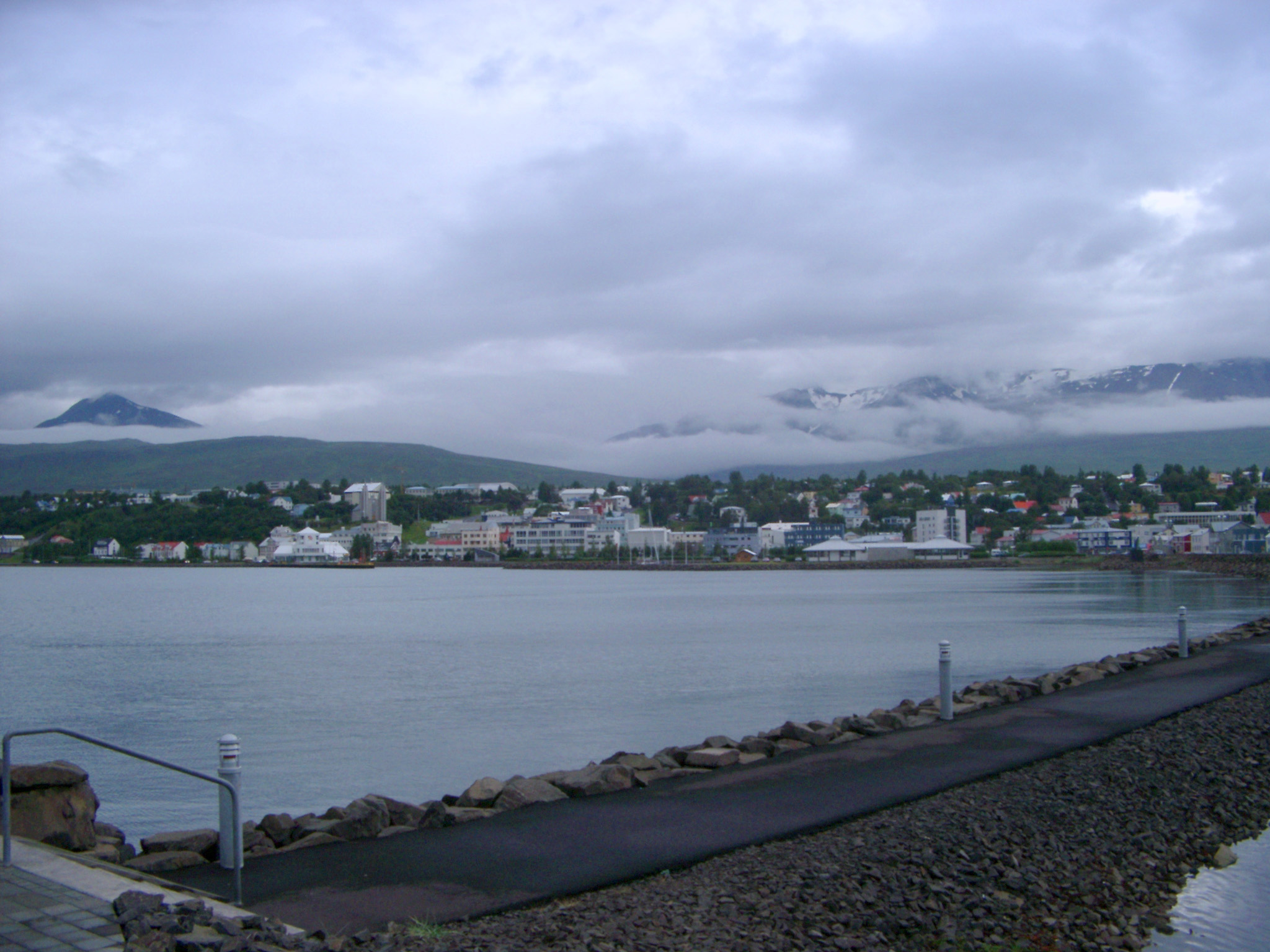 an image of View of Akureyri from Across Eyjafjorour Fjord on Cloudy Grey Day, Iceland
