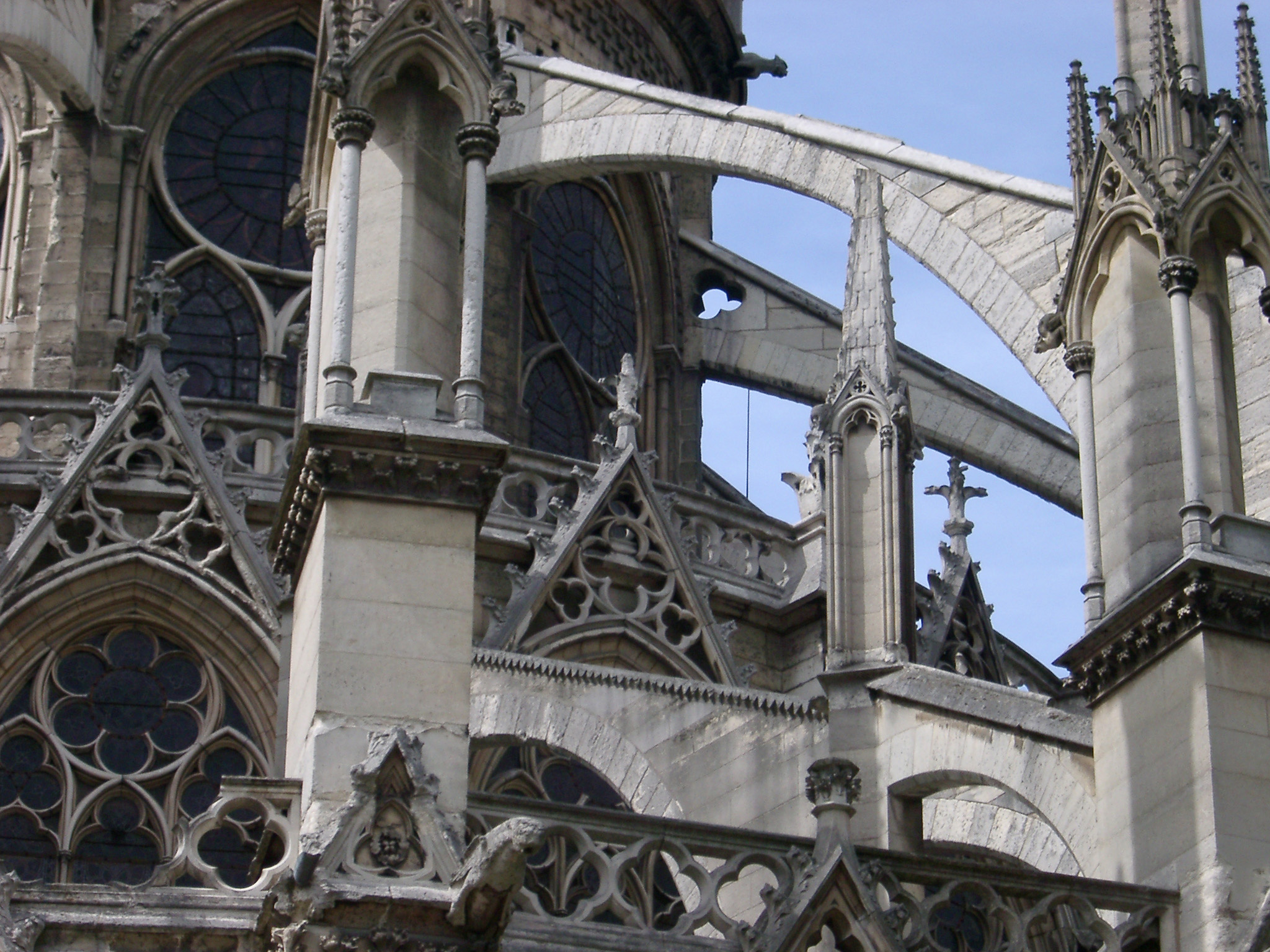 an image of Notre Dame Cathedral architectural detail showing the flying buttress, gargoyles and stone spires, Paris