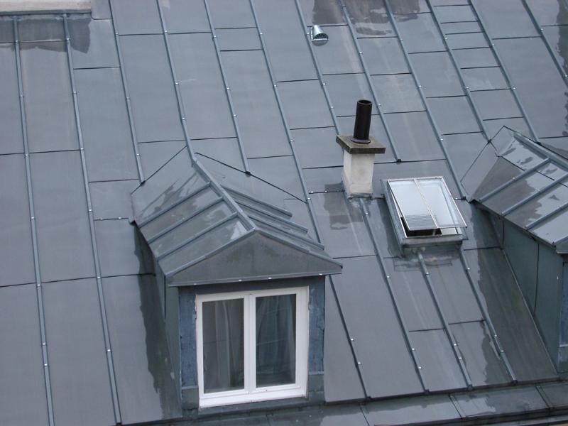 Close up Shiny Gray Metallic Building Rooftop. Captured in Aerial View.