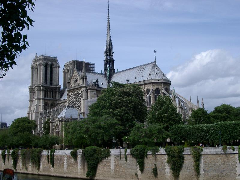 Notre Dame Cathedral viewed from the side from the bank of the Seine River showing the flying buttress design