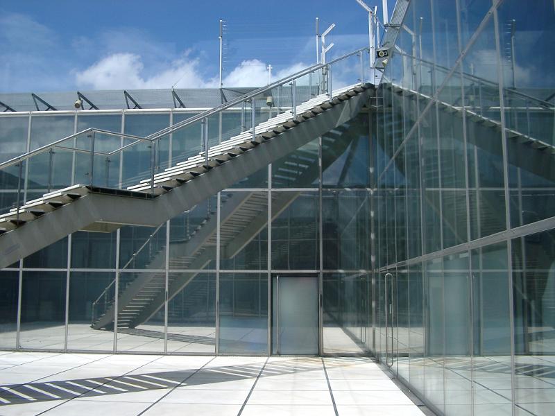 Long Metallic Stairs at Architectural Glass Building. Captured at Daylight.