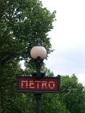 Paris Metro Sign and Lamp Post with Trees in Background, Paris, France
