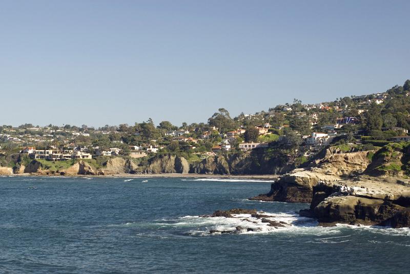 Beautiful La Jolla Cove Beach in California on Gradient Light Blue Gray Sky Background. A Good Place for Unwind.