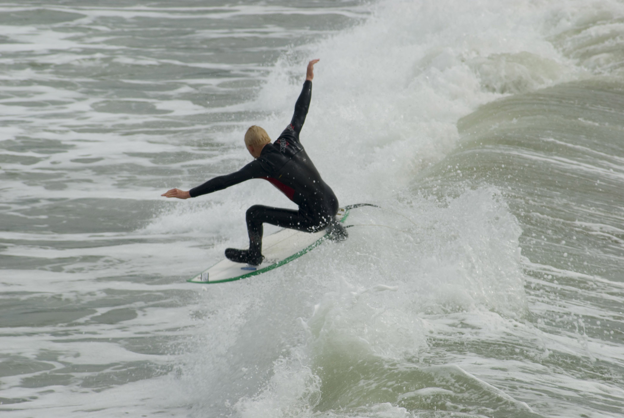 an image of Surfer in Perfect Balancing Position of the californian coast