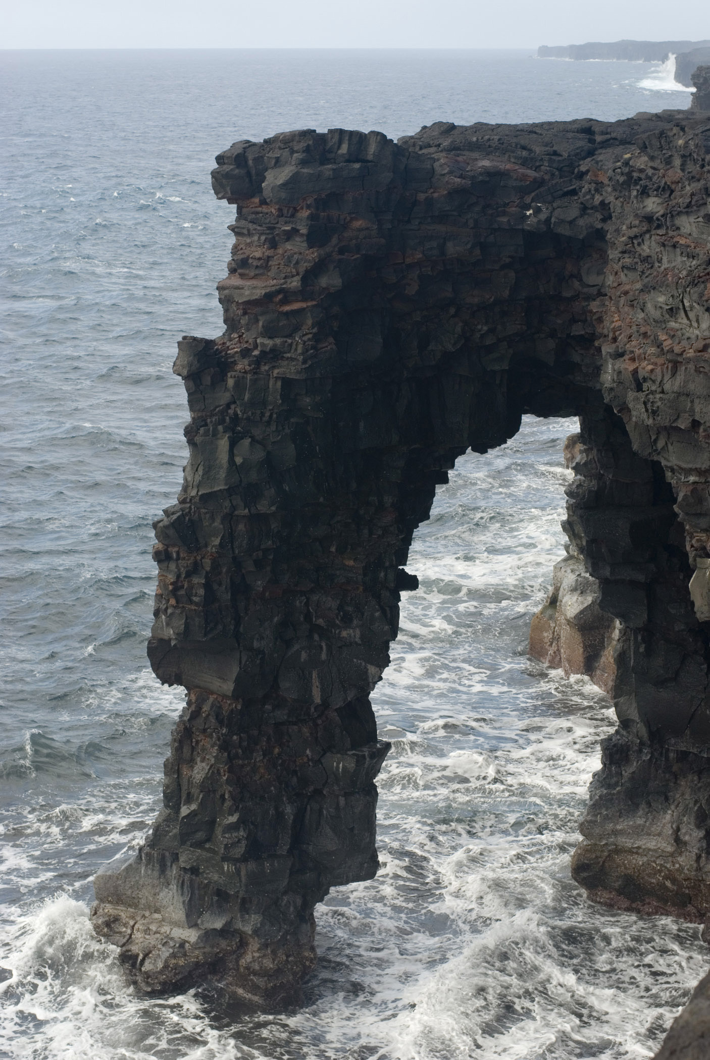 an image of Historic Structure of Holei Sea Arch on South Coast Hawaii Volcanoes National Park.
