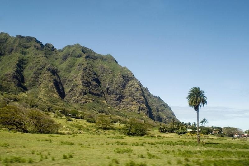Beautiful Greenery Spot at Koolau Mountain Range. Isolated on Light Blue Sky Background.
