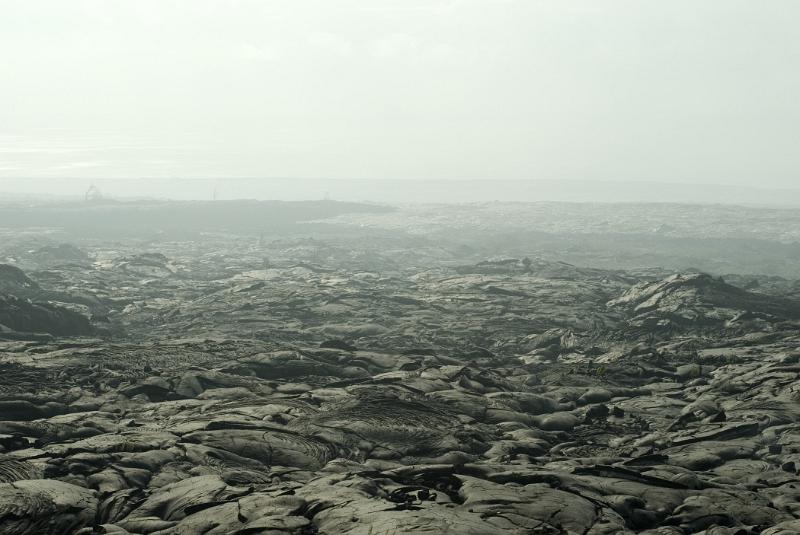 Smoke at Black Surface Textured Lava Field in Extensive Panoramic View, Located in Hawaii.