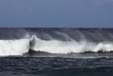 Big waves off the North Shore, Hawaii with spray whipped up by the wind, a popular area for surfers
