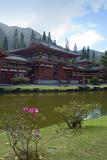 Byodo-In Buddhist Temple, a replica Japanese temple for worship in the lush Hawaiian landscape, viewed across a tranquil pond