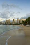 Seashore at Beautiful Waikiki Beach with Tall Building Structures View at Far Distant.
