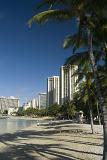 Scenic view of Waikiki Beach, Oahu Island, Hawaii, with its golden sand, palm trees and apartment buildings