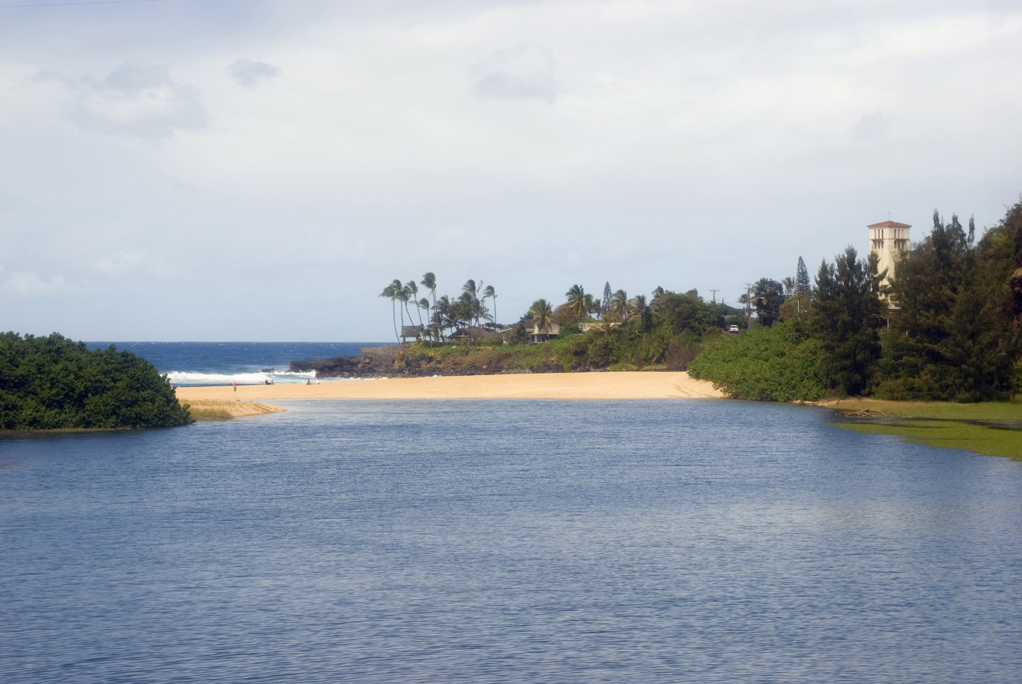 an image of Scenic view of the sheltered lagoon and bay at Waimea Beach Park, Ohau, Hawaii
