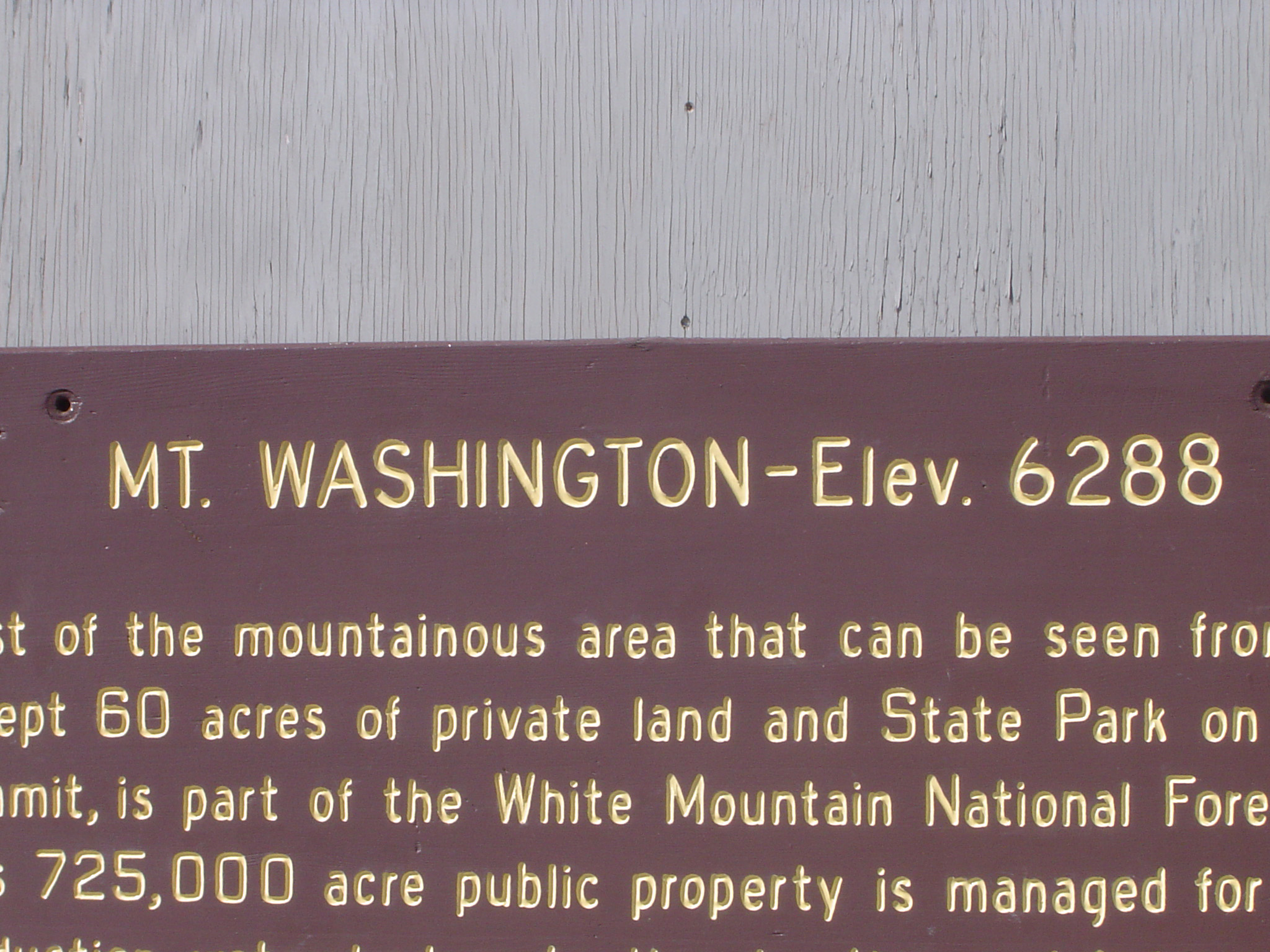 an image of Mount Washington information sign giving details of the elevation and size in close up detail