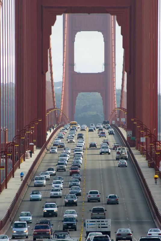 View of heavy traffic on the Golden Gate Bridge View of heavy traffic on the Golden Gate Bridge between the support towers for the suspension cables with commuters crossing the San Francisco Bay
