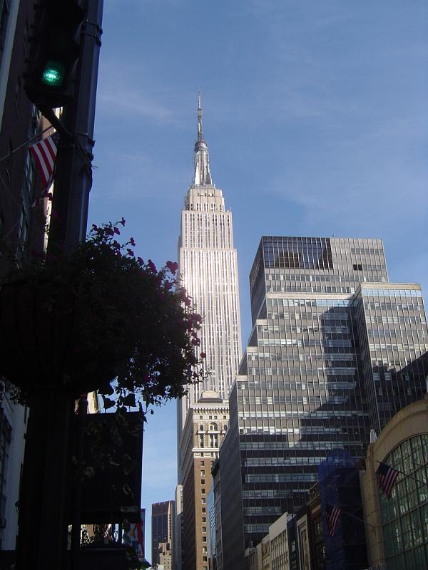 Old Vintage Tall Empire State Building in New York, Isolated on Light Blue Sky Background.