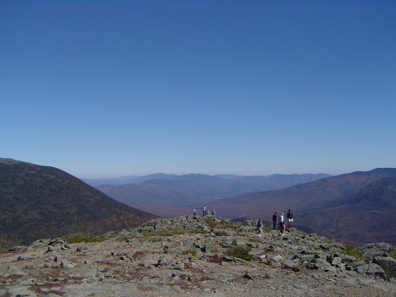 Huge Mountains Isolated on Gradient Blue Sky Tourists at Huge Mountains Isolated on Gradient Blue Sky Background.