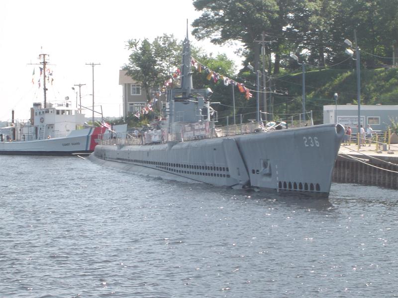 US navy submarine Historical US navy submarine moored on the surface at a dock under colorful bunting