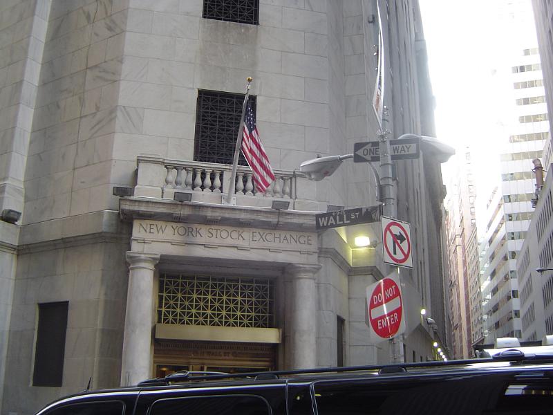 New York Stock Exchange Building at Wall Street Old Vintage New York Stock Exchange Building with Small American Flag and Signage in Front at Wall Street