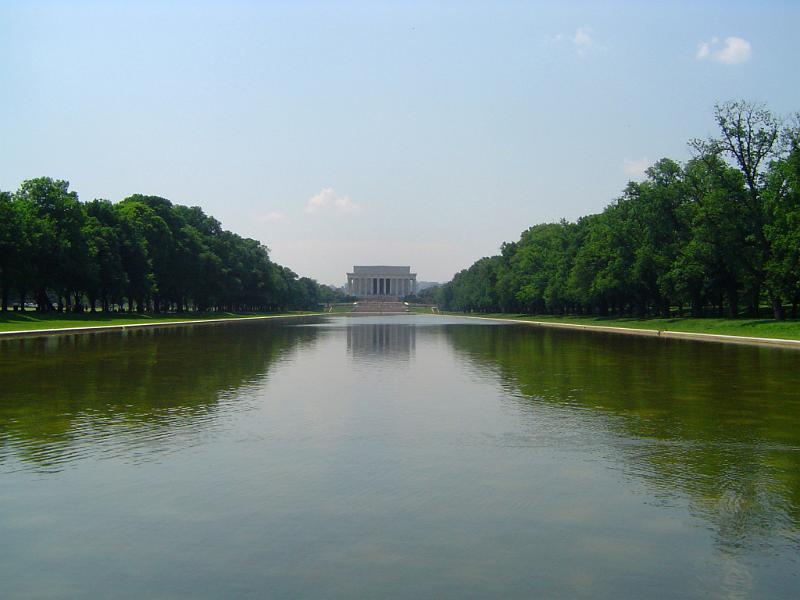 Reflecting Pool in Front Lincoln Memorial Building Surrounded by Tall Green Trees, Located in Washington
