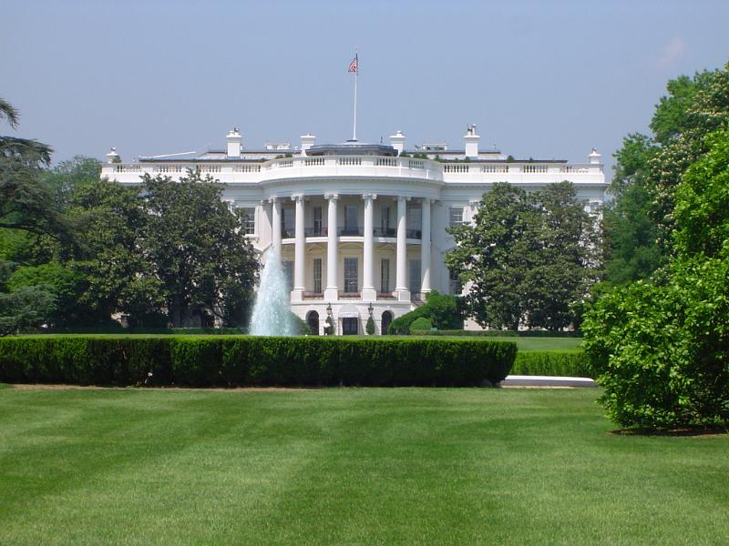 Scenic view of the White House, Washington DC Scenic view of the exterior of the White House, Washington DC viewed across manicured green lawns on a sunny summer day