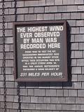 Windiest place on earth with a metal plaque on Mount Washington recording the highest winds of 231 miles per hour ever recorded by man