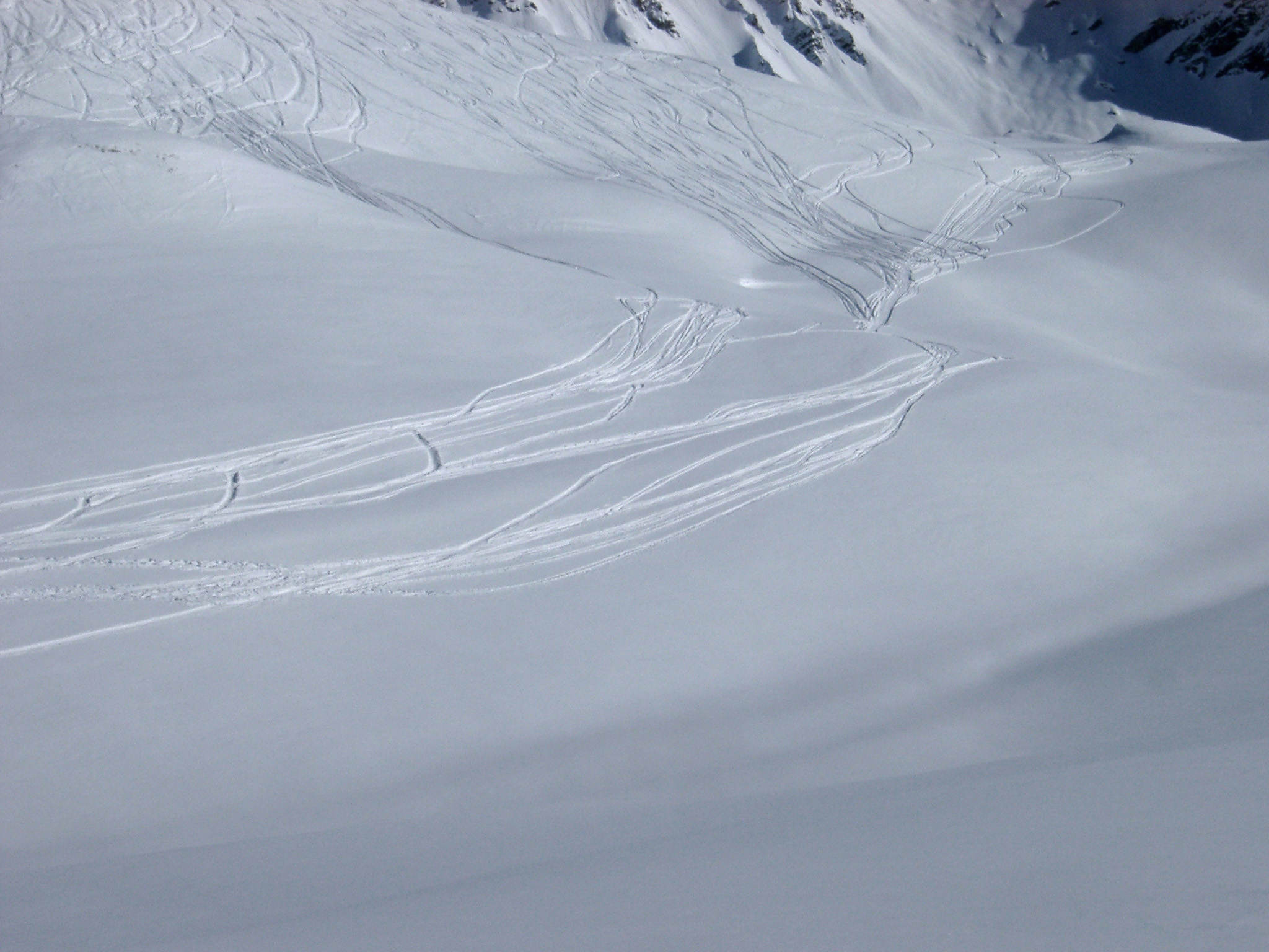 an image of Beautiful Extensive View of Fresh Snow in Wide Snow Field with Board Trails During Winter Holiday.