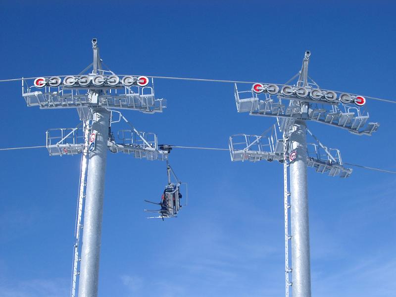 Empty Cable Cars on Light Blue Sky Background.