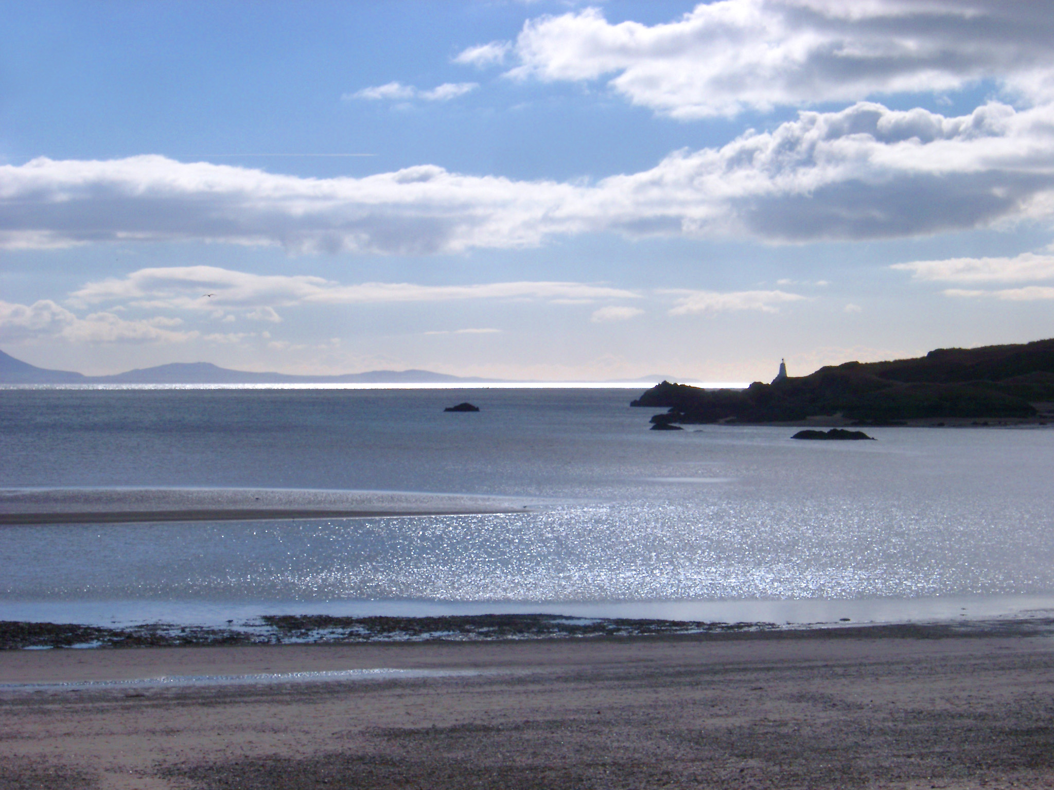 an image of A view to the mainland from Ynys Llanddwn on angelsey, wales.