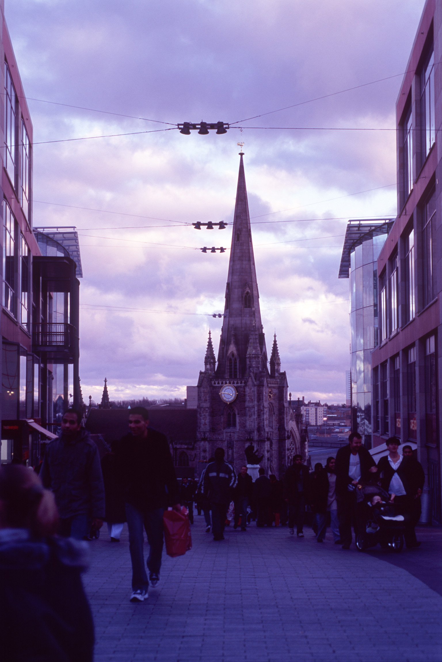 an image of St Martin Church and City Shop Buildings in England, Captured with Random People Passing By