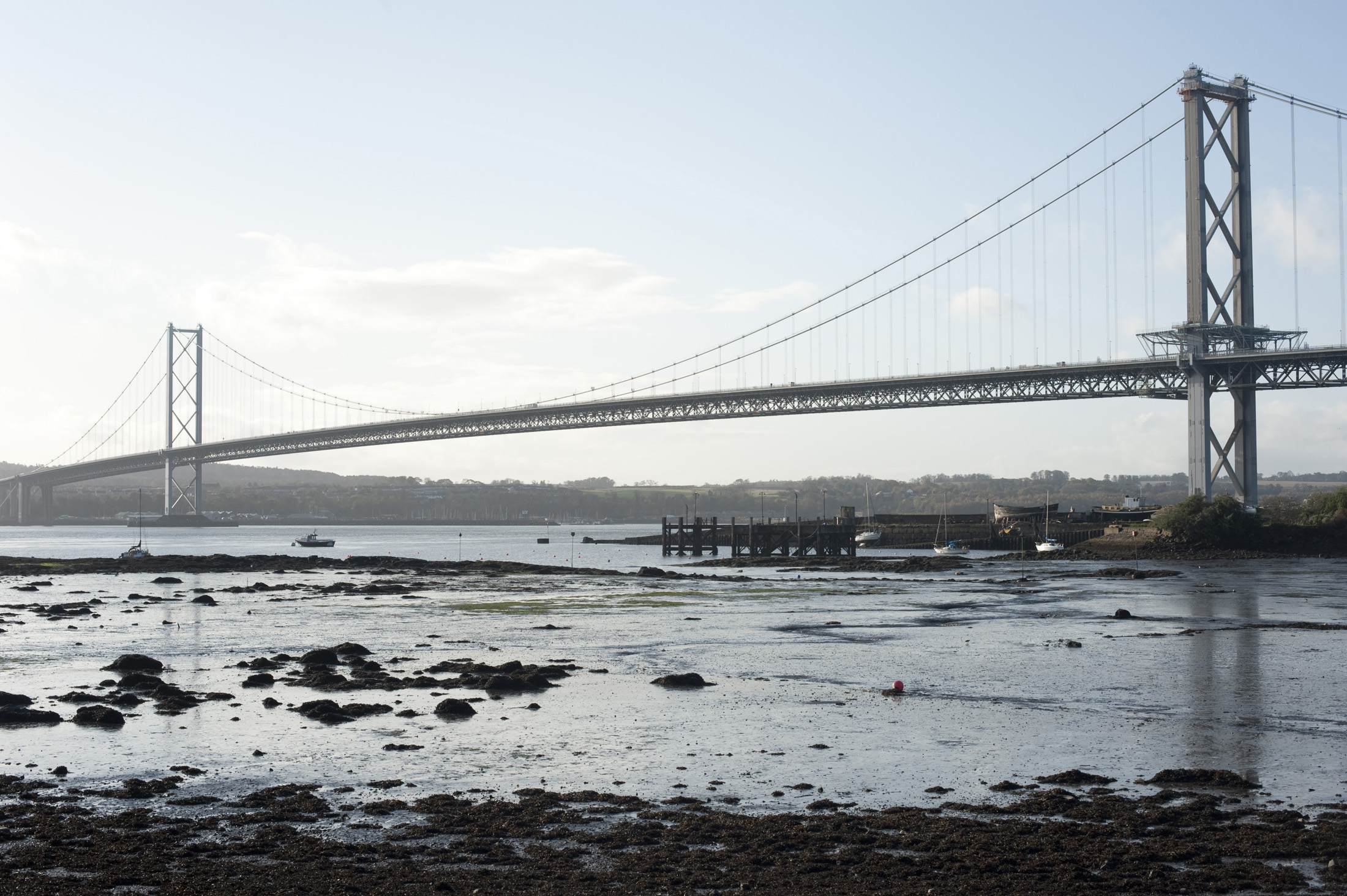 an image of a view of the forth road bridge from north queensferry, scotland