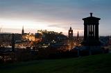 A view of edinburgh at nght from carlton hill with the Dugald Stewart Monument in the foreground