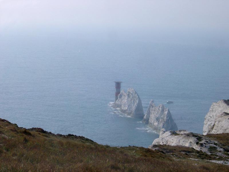 View from the headland looking down on the The Needles, a row of chalk stacks rising directly from the ocean on the Isle of Wight