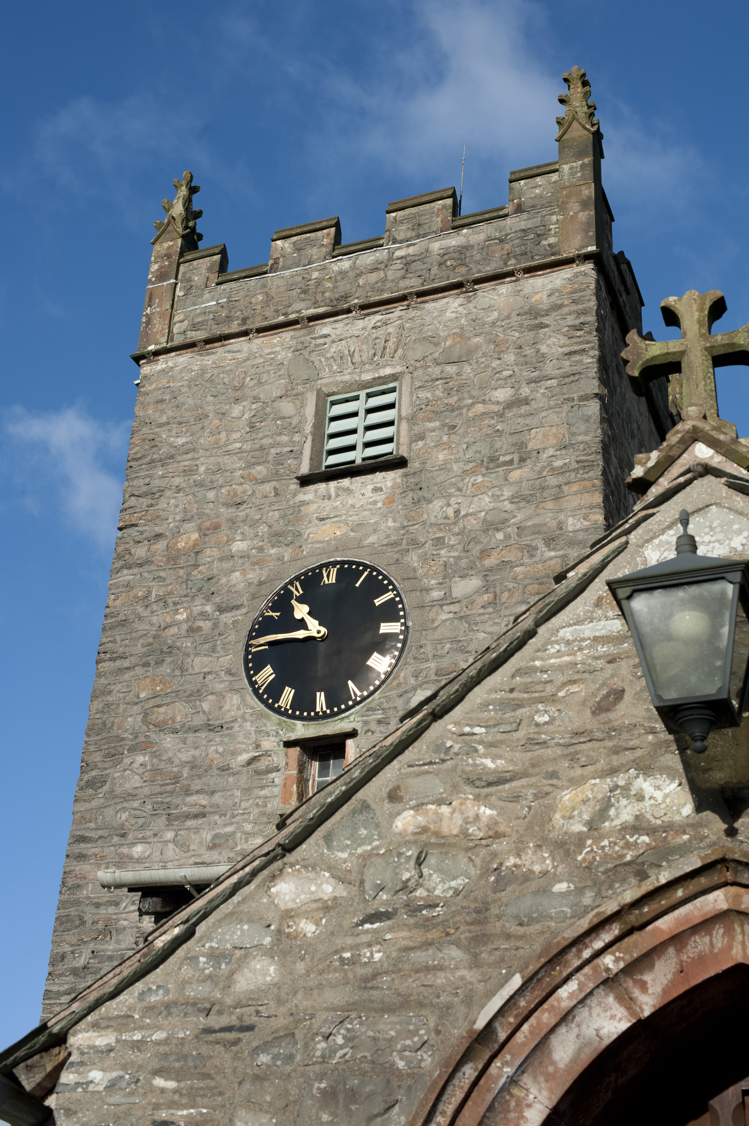 an image of The tower of St Michael and All Angels church, hawkshead, cumbria