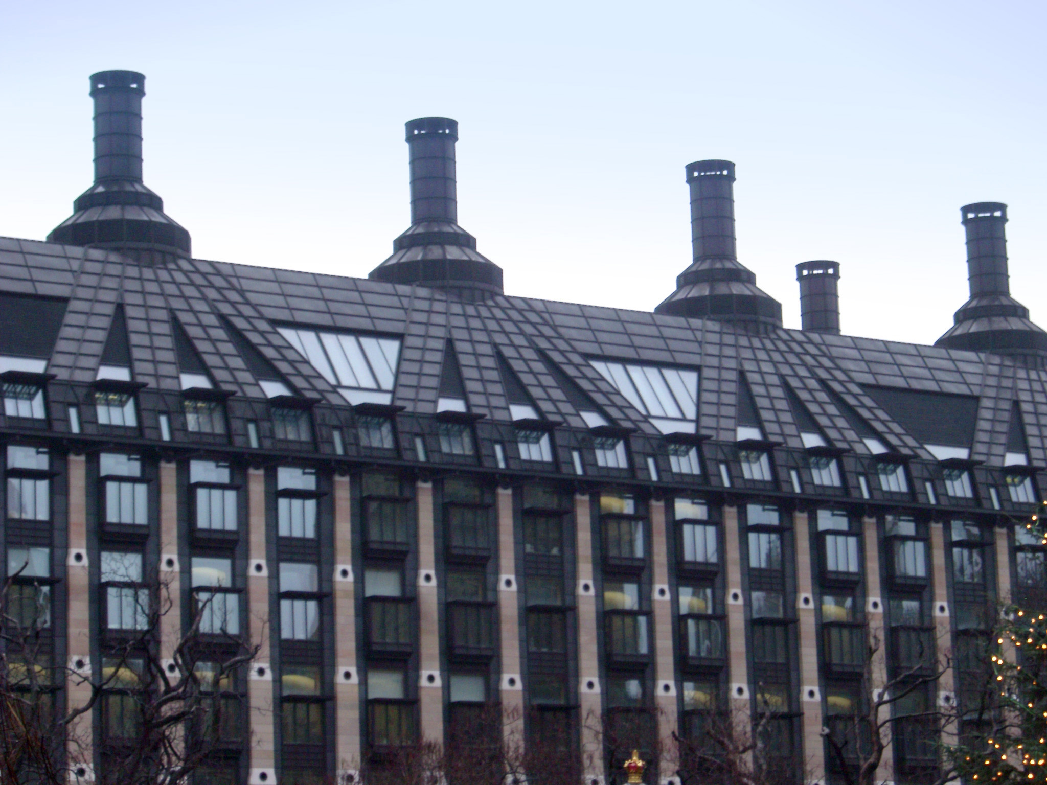 an image of Exterior View of Portcullis House in Westminster, England on Very Light Blue Sky Background.