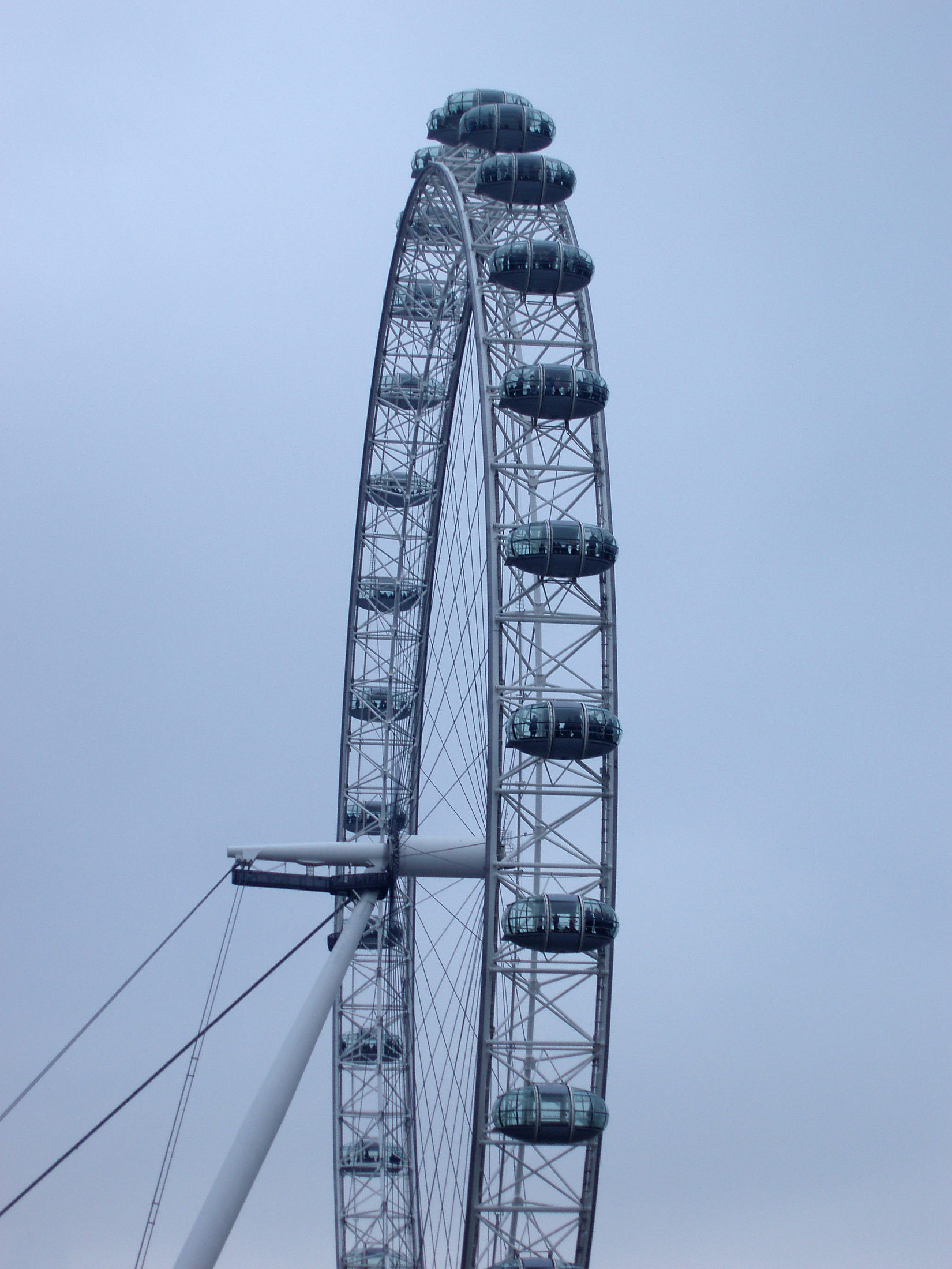 an image of London Eye Millennium Wheel with a close up view of the rim showing the ovoid capsules used as observation posts for passengers and tourists giving a panoramic view of central London and the Thames