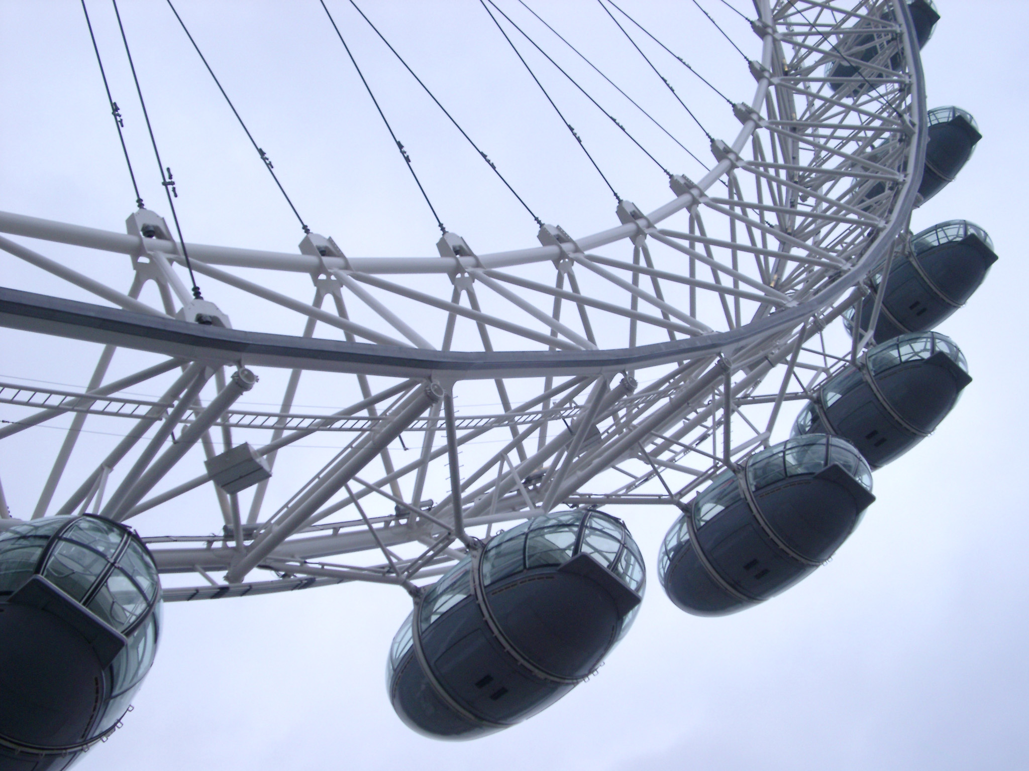 an image of Detail of the ovoid passenger capsules on the rim of the London Eye used as observation posts for viewing central London and the River Thames and a popular tourist attraction