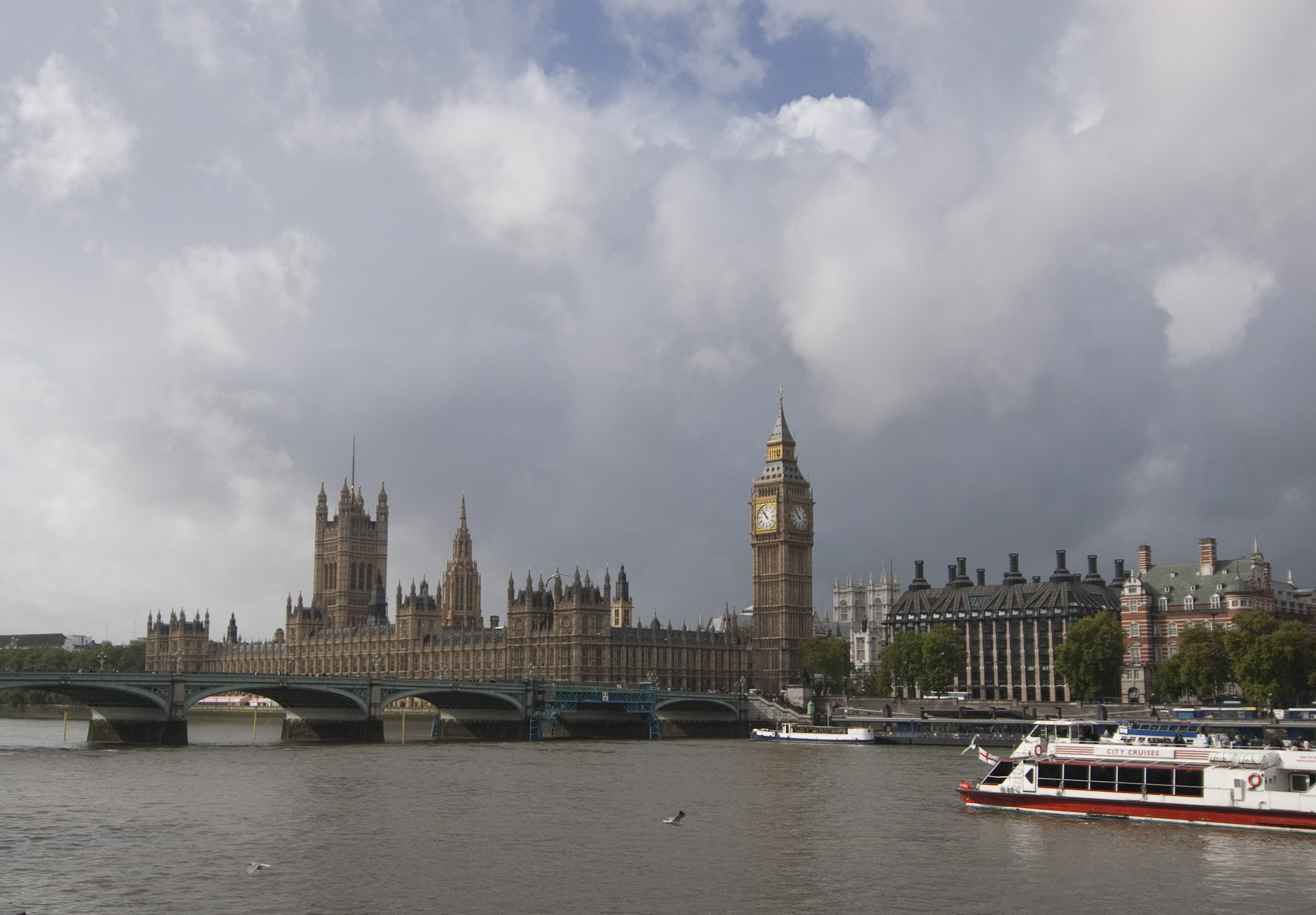 an image of a view of the palace of westminster and big ben clock tower from across the river and westminster bridge