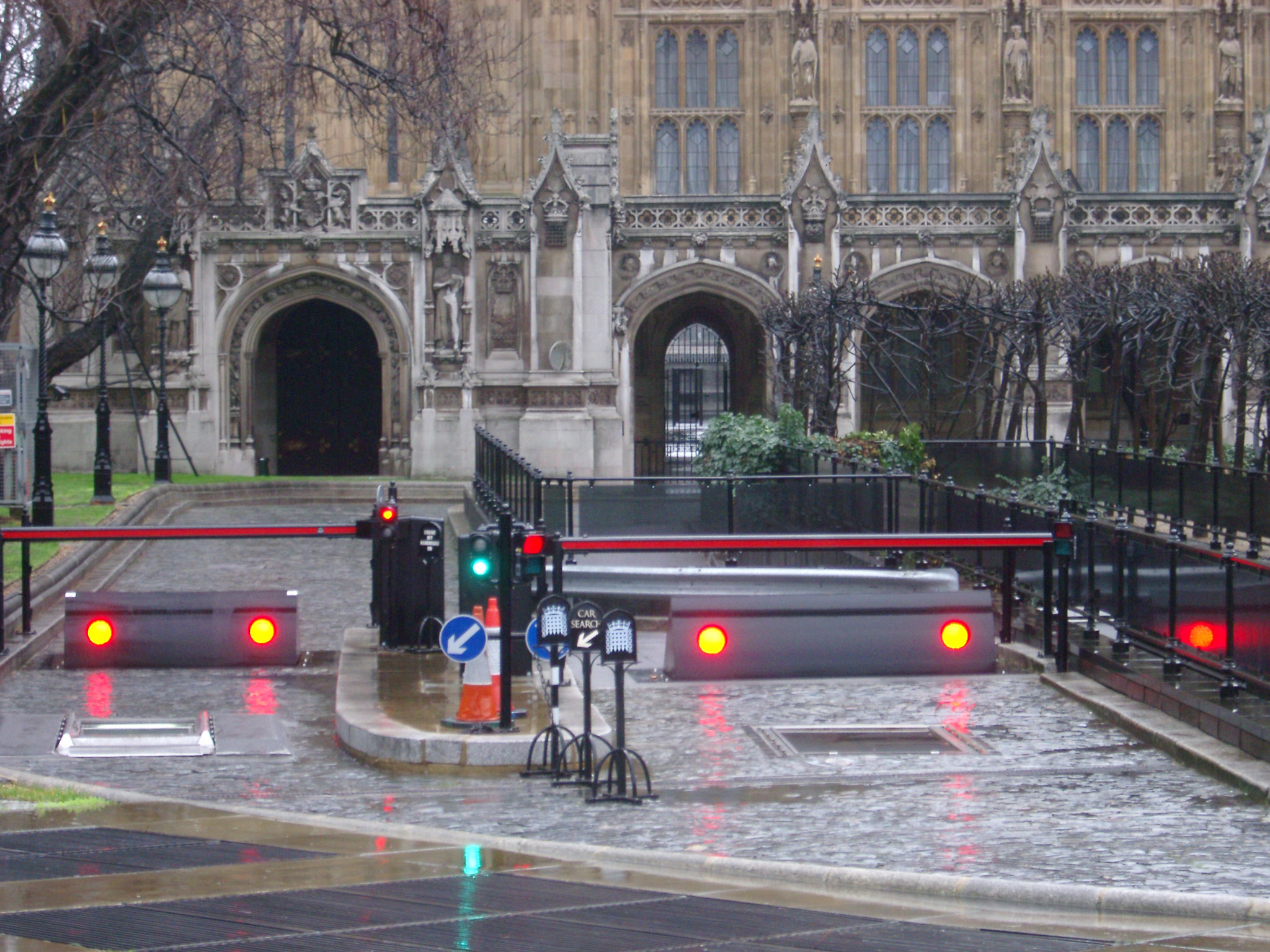 an image of Security barricades and gate outside the Houses of Parliament in London